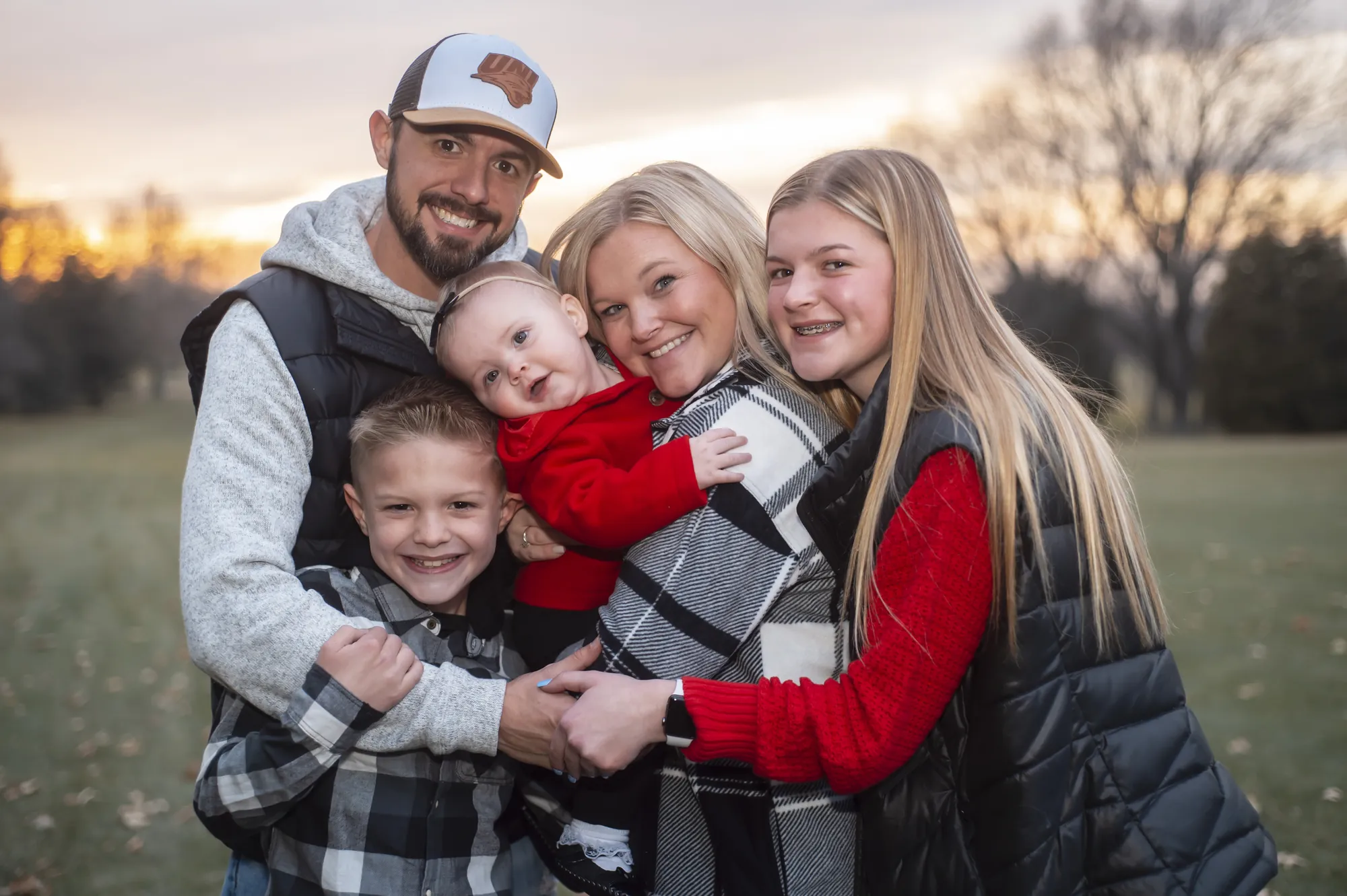 Family photos in the Cedar Valley, family hug at sunset